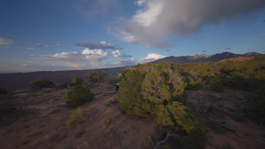 Person on a mountain bike through a canyon