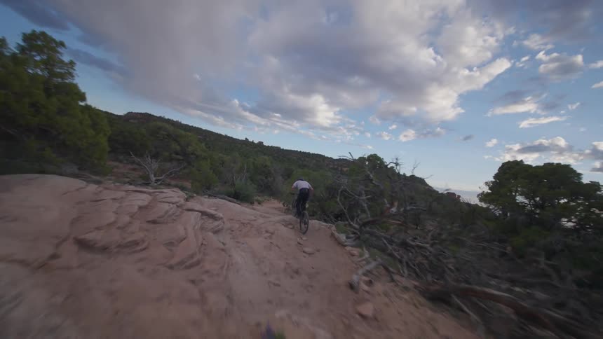 Person riding a mountain bike on a mountain