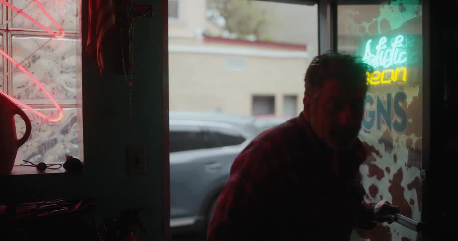 A man opens the door and enters the shop