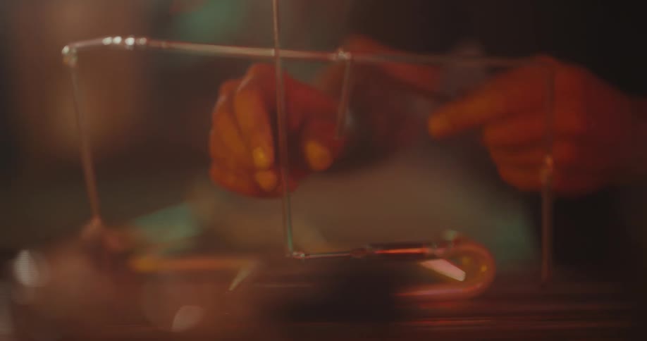 Hands of a person clenching a tube of an object