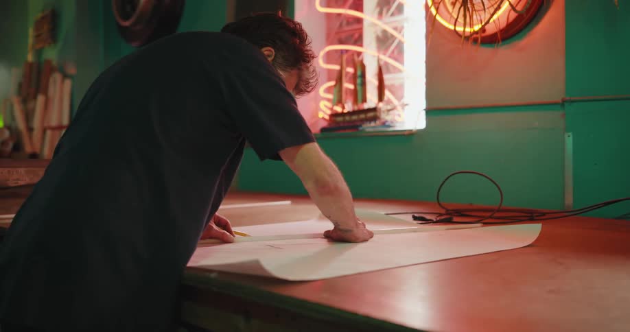 An employee is drawing up plans for a project