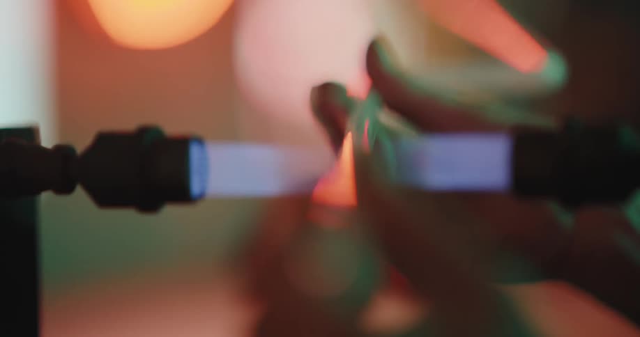 Glass tube being placed on fire