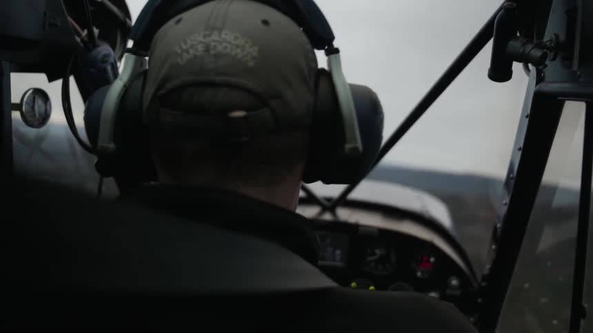 A pilot flies an aerial vehicle