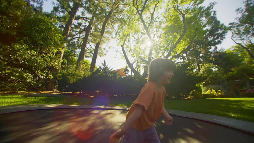 A child has fun jumping on the trampoline