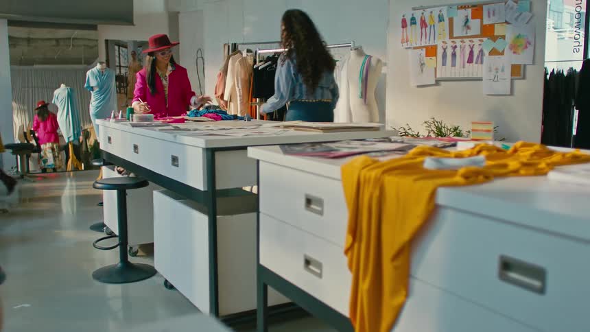 Fashion designers working on a busy workshop