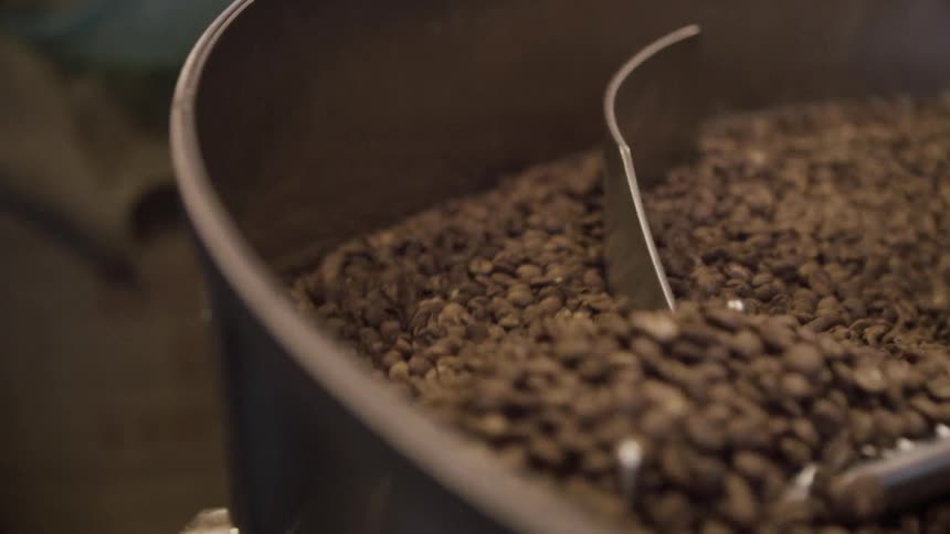 Coffee beans being mixed in mixing container