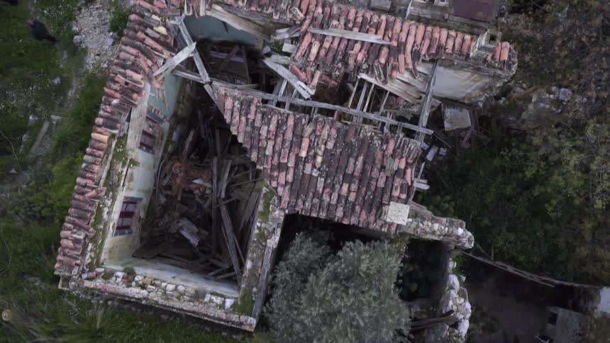 A bird's-eye-view of a destroyed brick home