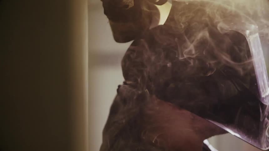 Person welding and the smoke that emits from it