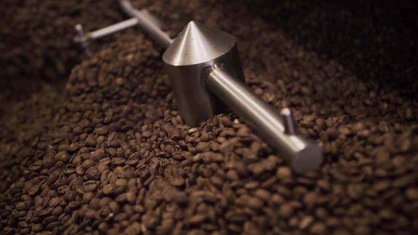 Coffee beans spinning around in a machine