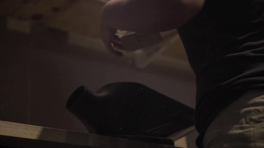 A woman is putting items on a shelf