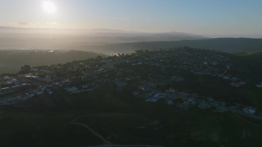A suburban area surrounded by mountains