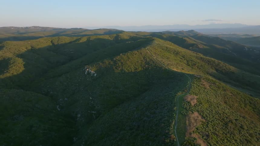 Aerial panorama of mountain ranges in a clear sky