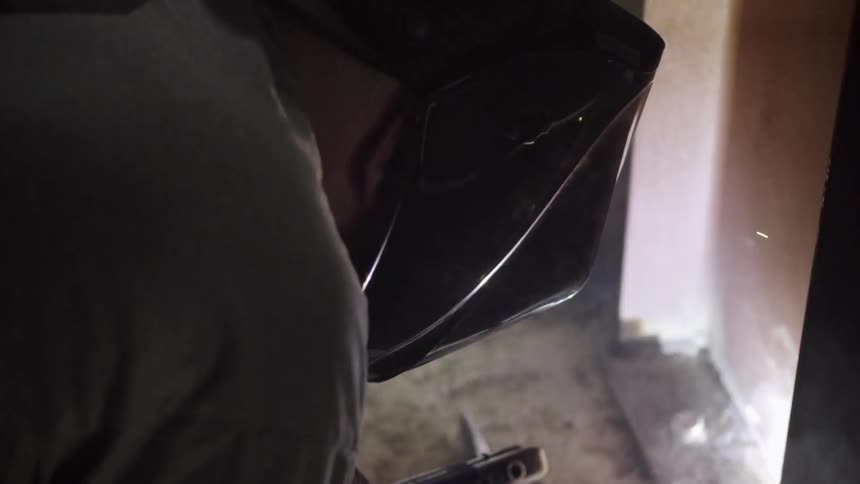 Sparks fly as a welder does his job