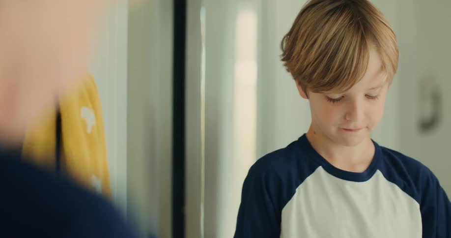 A young boy prepares to brush his teeth