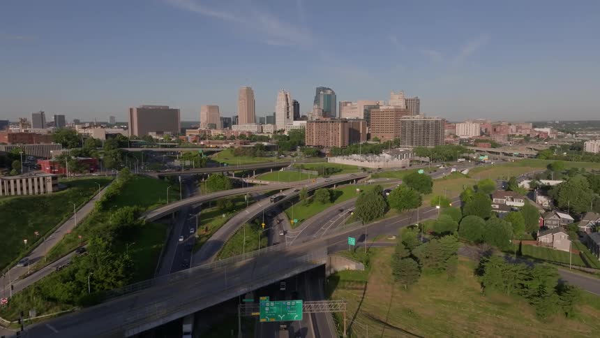 Traffic flows smoothly on the freeway near the city