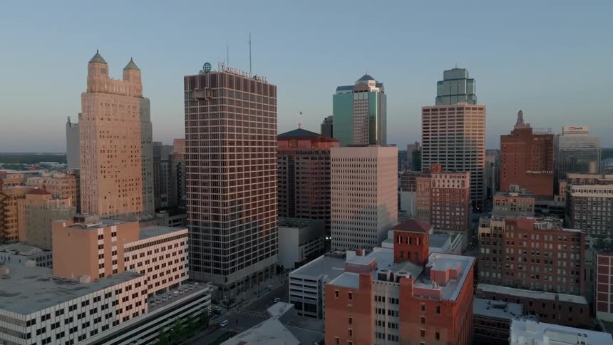 A center of a metropolitan city with tall buildings on a day with clear blue sky