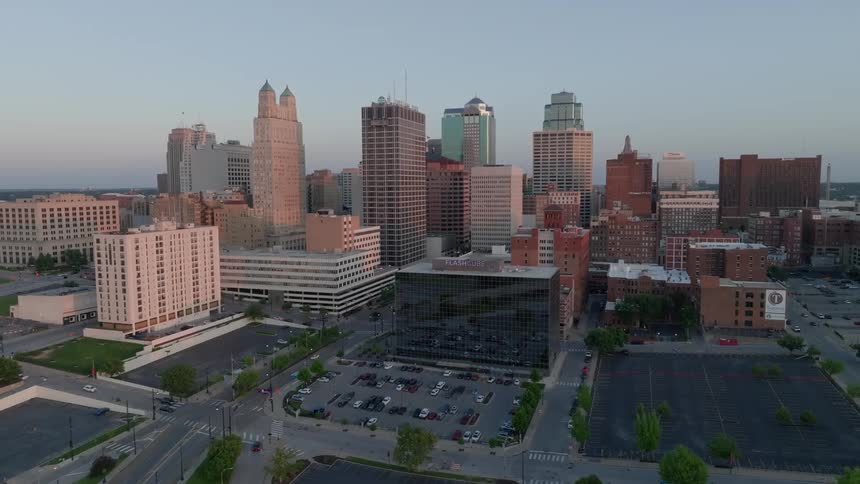 Light traffic drives along the downtown streets of a small city