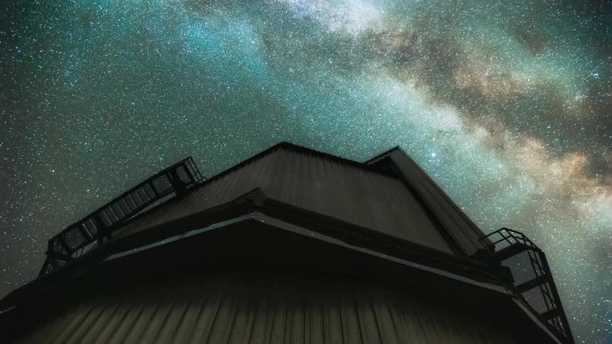 An observatory using spins while using lasers as the milky way galaxy moves in the sky above