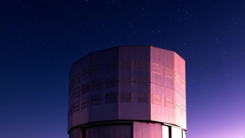 A very large telescope scans the sky as it transitions from dusk to night