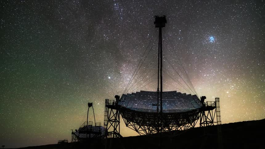 A large radio telescope against a starry night sky scanning for signals