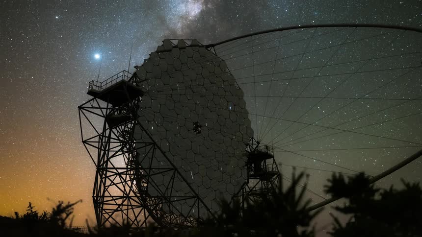 The starry sky reflects on the telescope