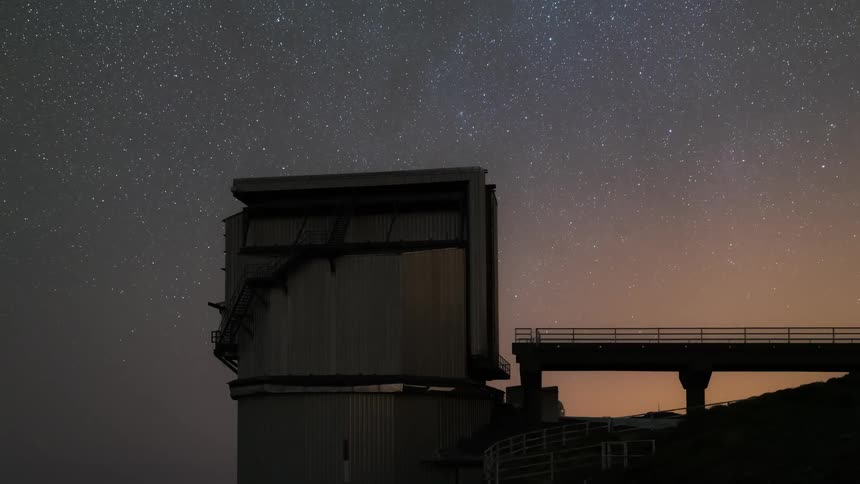 An observatory spins around to monitor the night sky