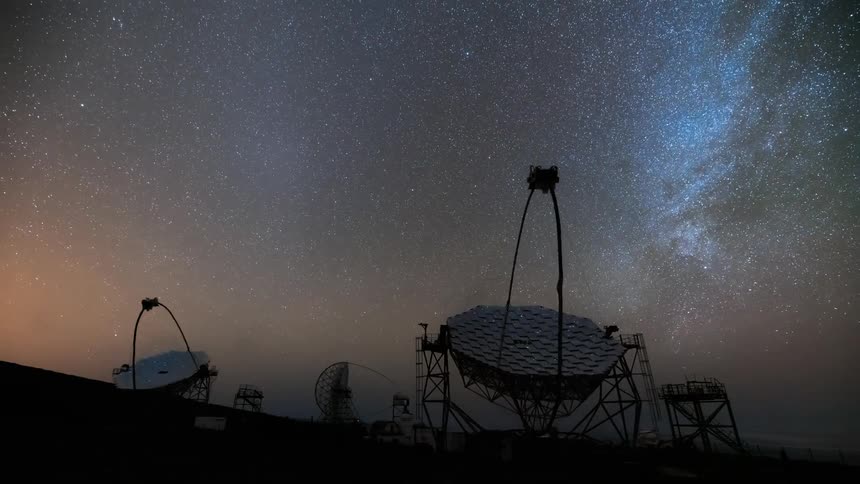 Starry night sky with the milky way visible accompanied by aurora borealis and several antennas and observatories pointing to the sky as the day dawns