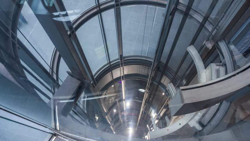 Elevator on a modern mechanical structure in motion