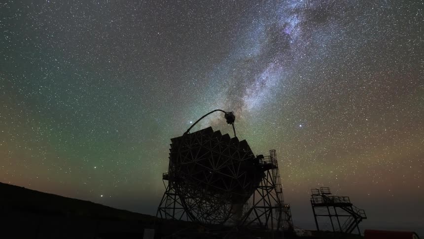 A radio telescope turns and spins to capture signals from outer space