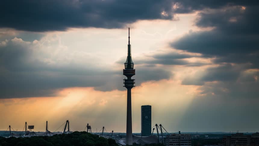 Heavy storm like clouds roil over a city and coast