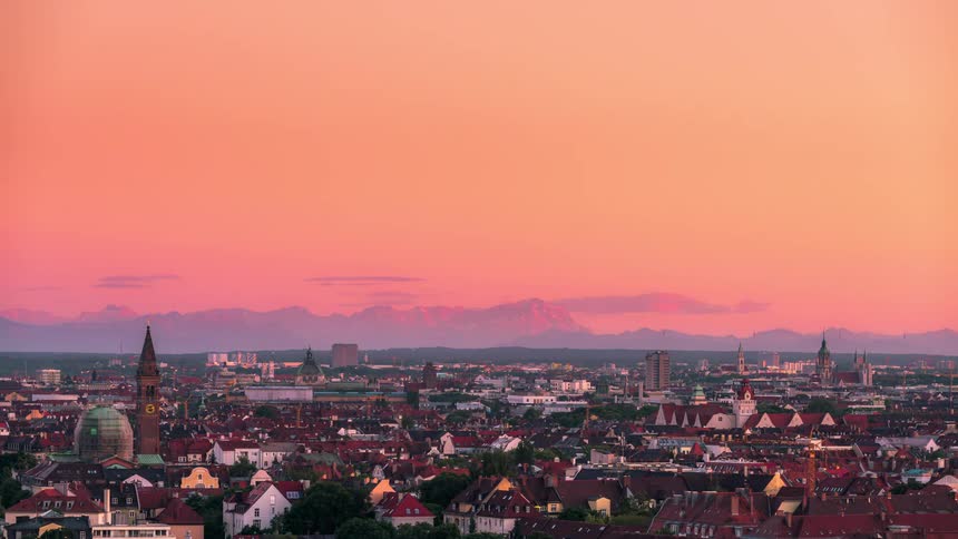 A vast and sprawling city with mountains in the distance