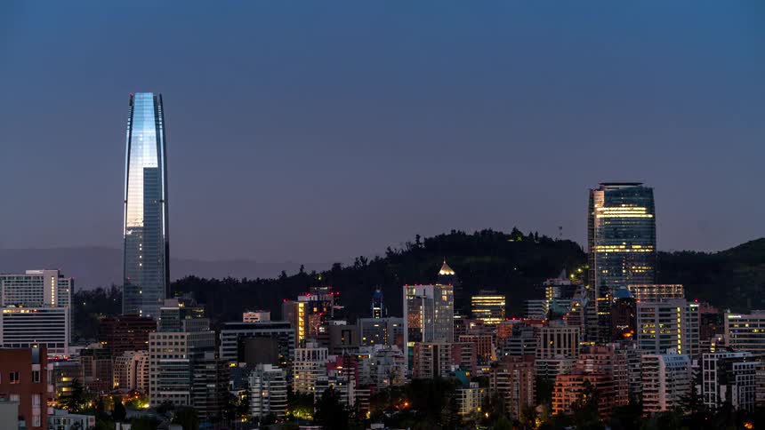 A skyscraper looms over a downtown city area
