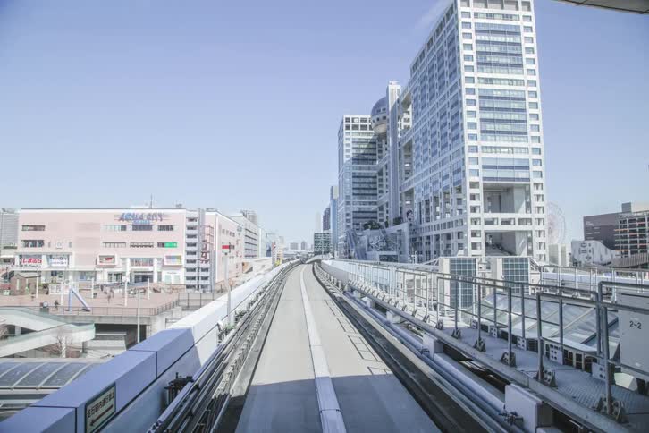 A train highway made of concrete and it is stopping at various terminals quickly