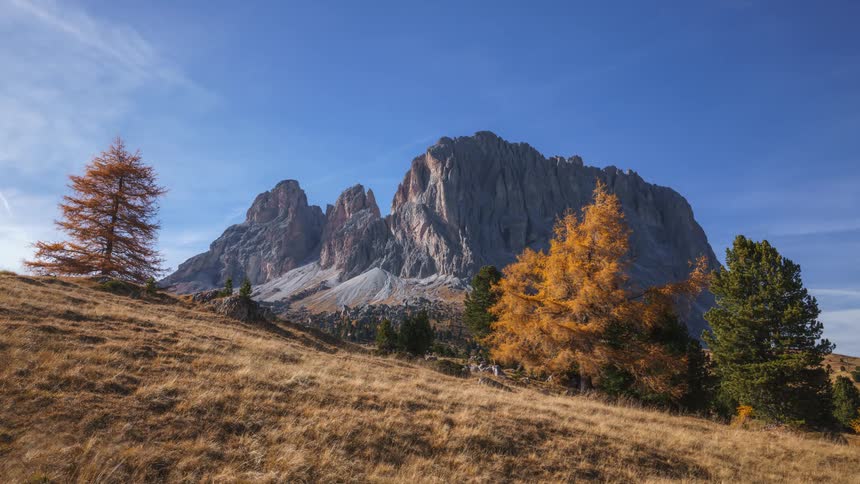 Airplanes fly over a giant mountain and grassy plains