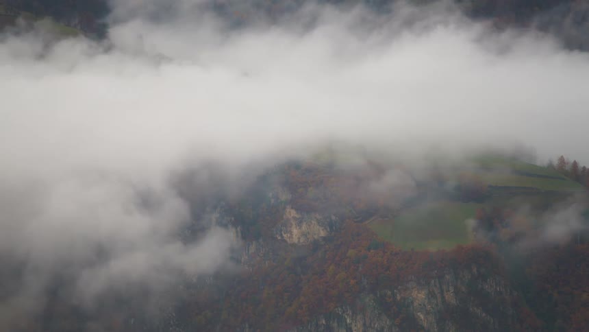 Time lapse of clouds rolling over a mountainous landscape