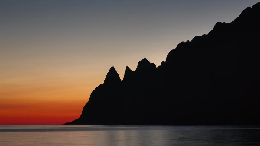 Landscape with a dusk and dawn day on the rocky coast by the sea