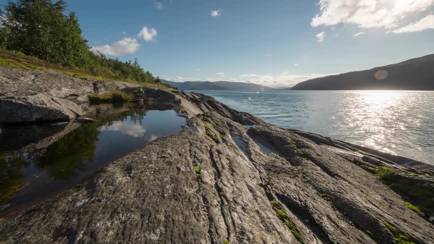 Landscape of seaside rocks on a partly cloudy day