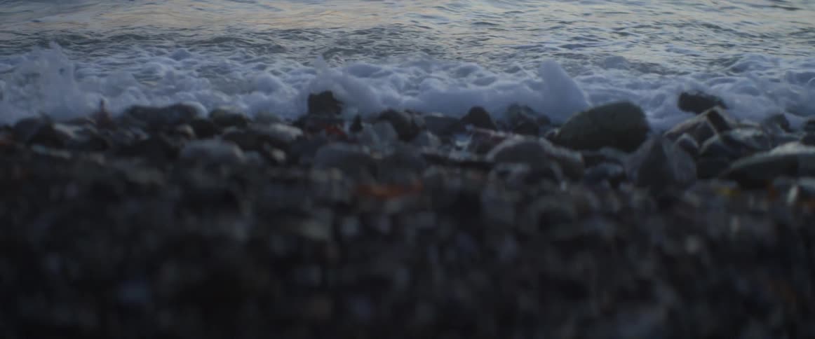 Water crashes on a rocky beach