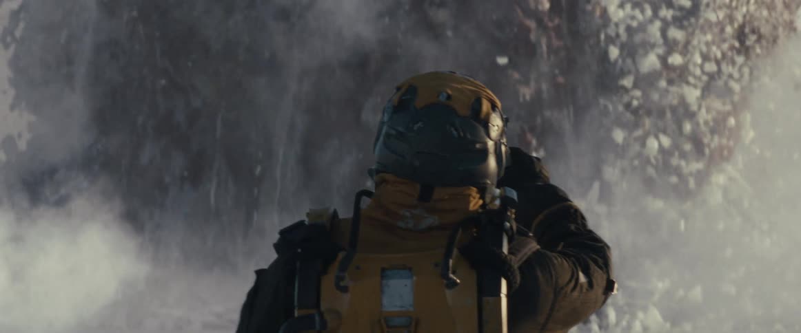 An astronaut witnesses a gigantic monster erupting through ice