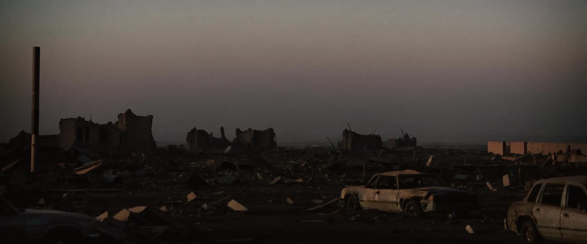 Junkyard full of busted cars and other metal scraps