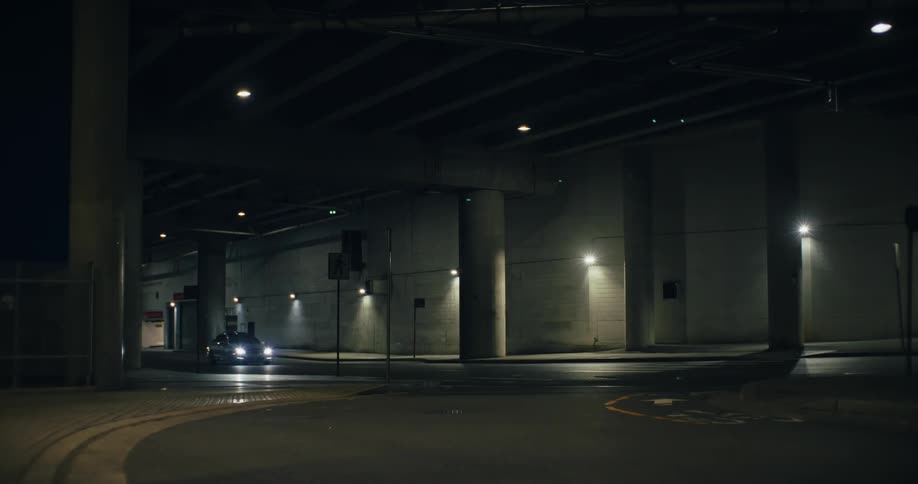 Cars passing on an expressway at night