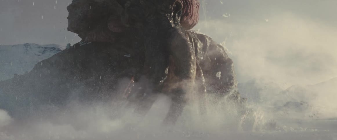 An enormous alien animal breaks through the ice on a foreign planet