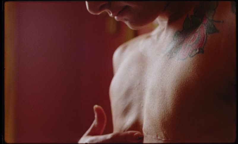 Woman passing her hand over her breast without breasts