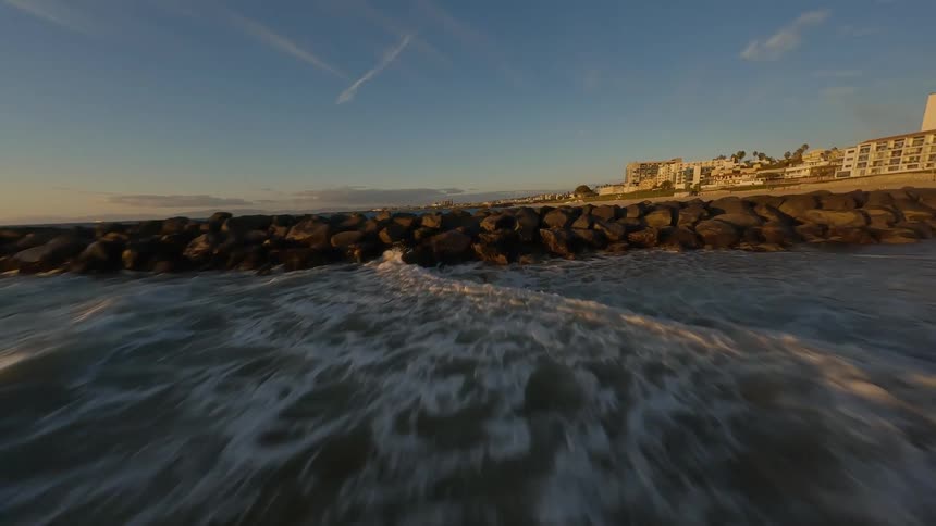 Aerial landscape of a beach with a hotel zone on the coast in a morning