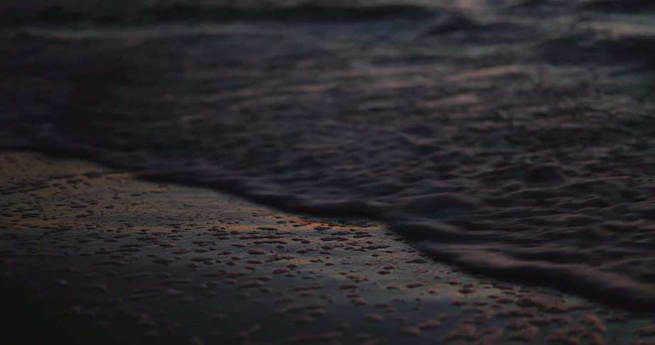 Closeup of water with ripples reflecting natural morning light