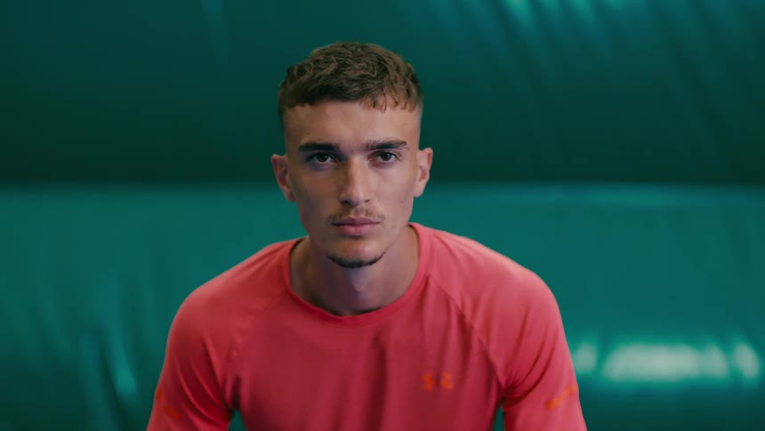 A man is looking determined and focused in a tennis match