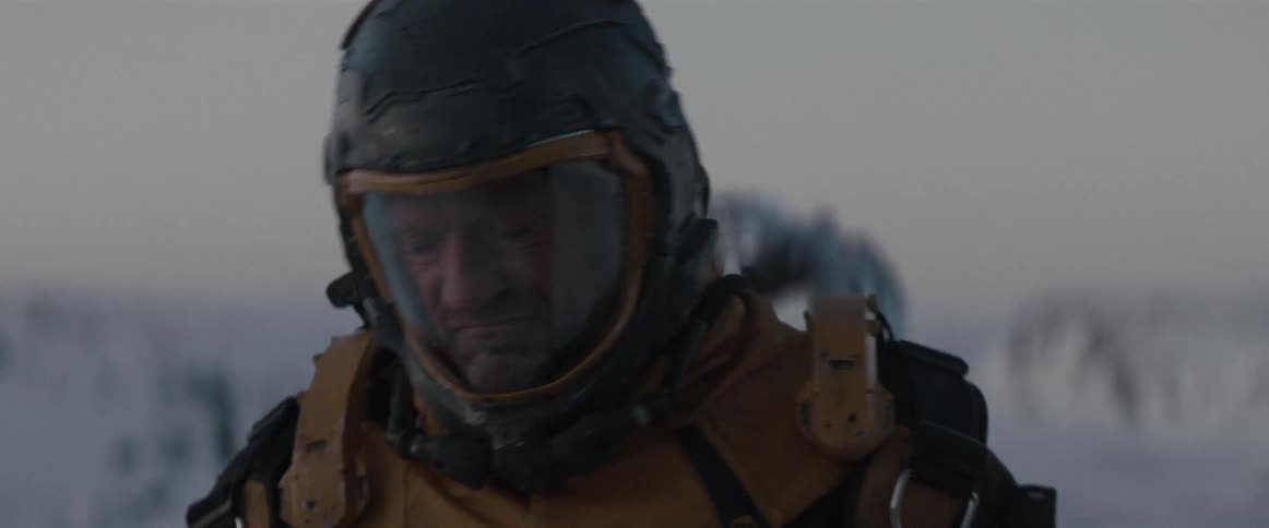 Man wearing a futuristic helmet and costume