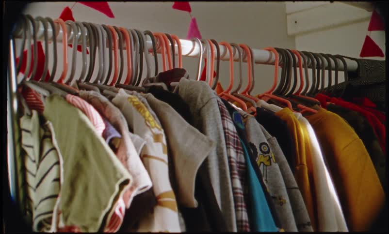 Closet full of multicolored colored shirts and sweatshirts