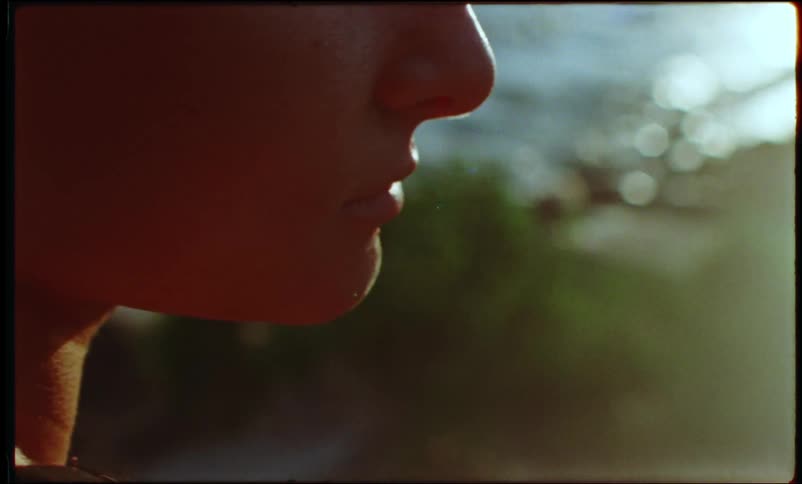 Portrait of a bald woman in an openair environment by the sea