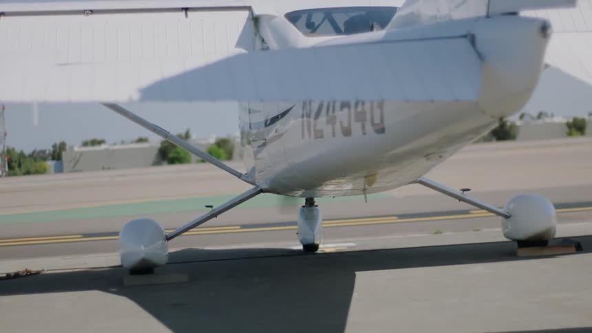 A plane idling on a runway at an airport